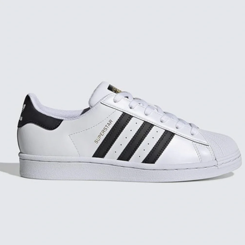 adidas Women’s White Sneakers with Black Stripes